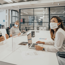 Load image into Gallery viewer, Office desk divider made from acrylic sheet with people sitting at the table

